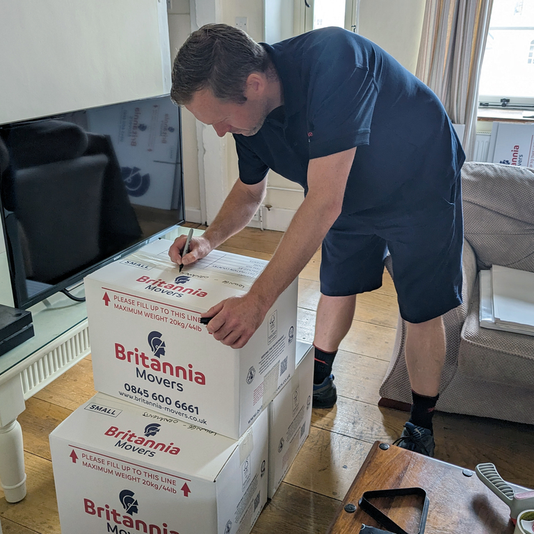 Delicate items being carefully wrapped - Image 3